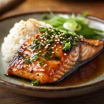 Miso Butter Salmon plated with rice and garnishes